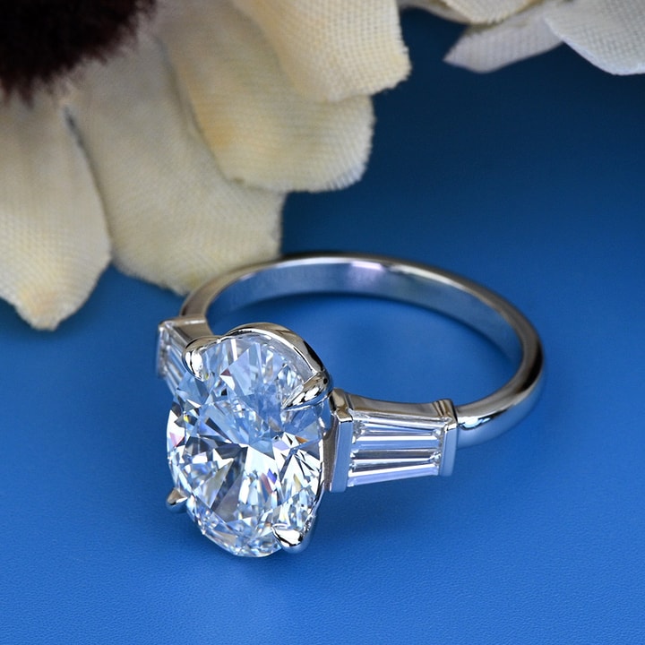 Diamond ring with shops baguettes on side