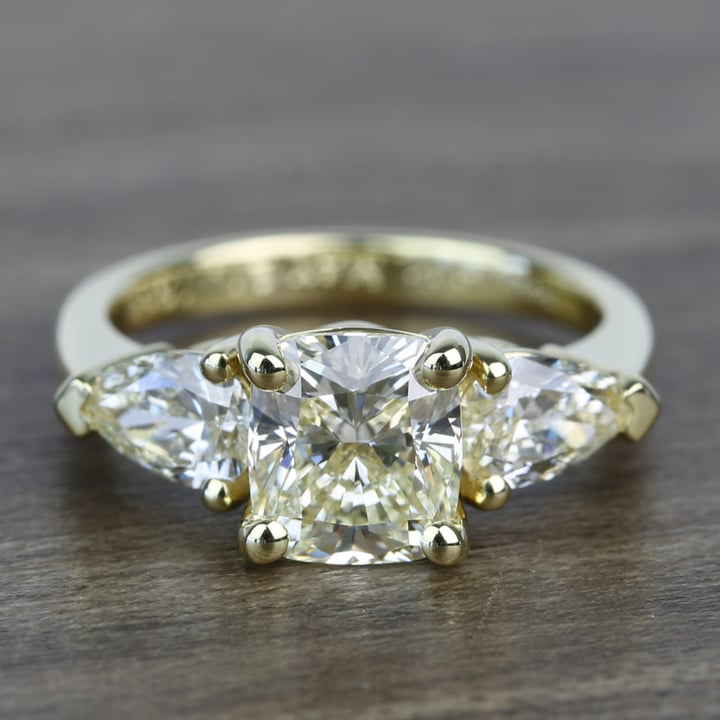 Cushion cut engagement ring hot sale with pear side stones