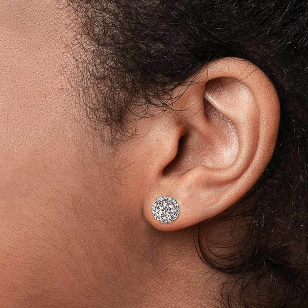 halo diamond earrings on ear