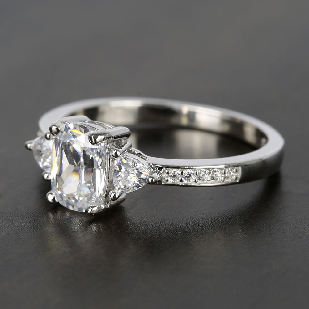 One Carat Oval Diamond Ring With Trillion Cut Diamonds