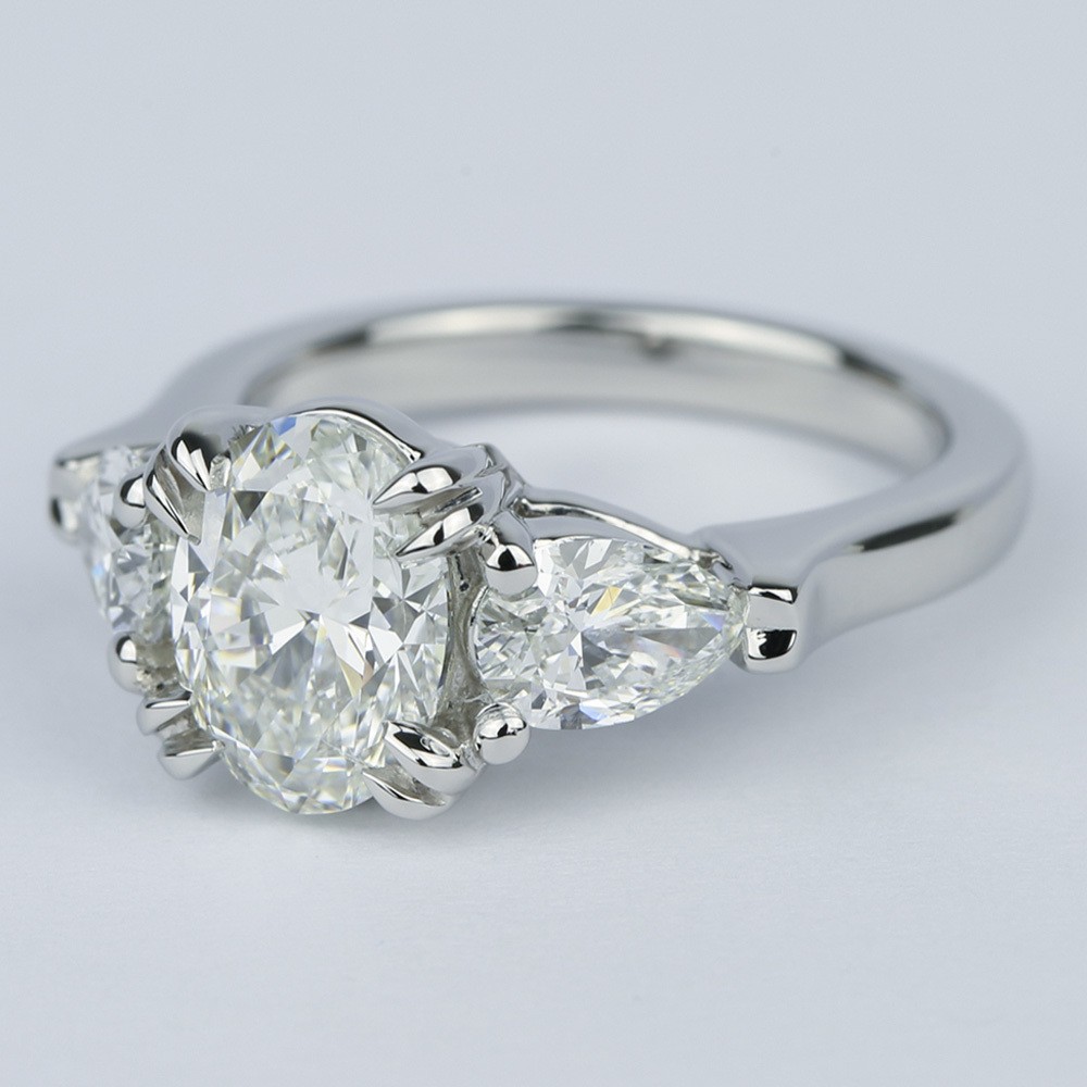 Platinum Oval Diamond Engagement Ring And Pear Diamonds