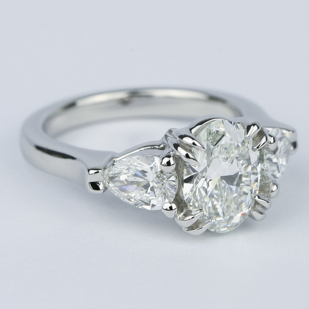 Platinum Oval Diamond Engagement Ring And Pear Diamonds