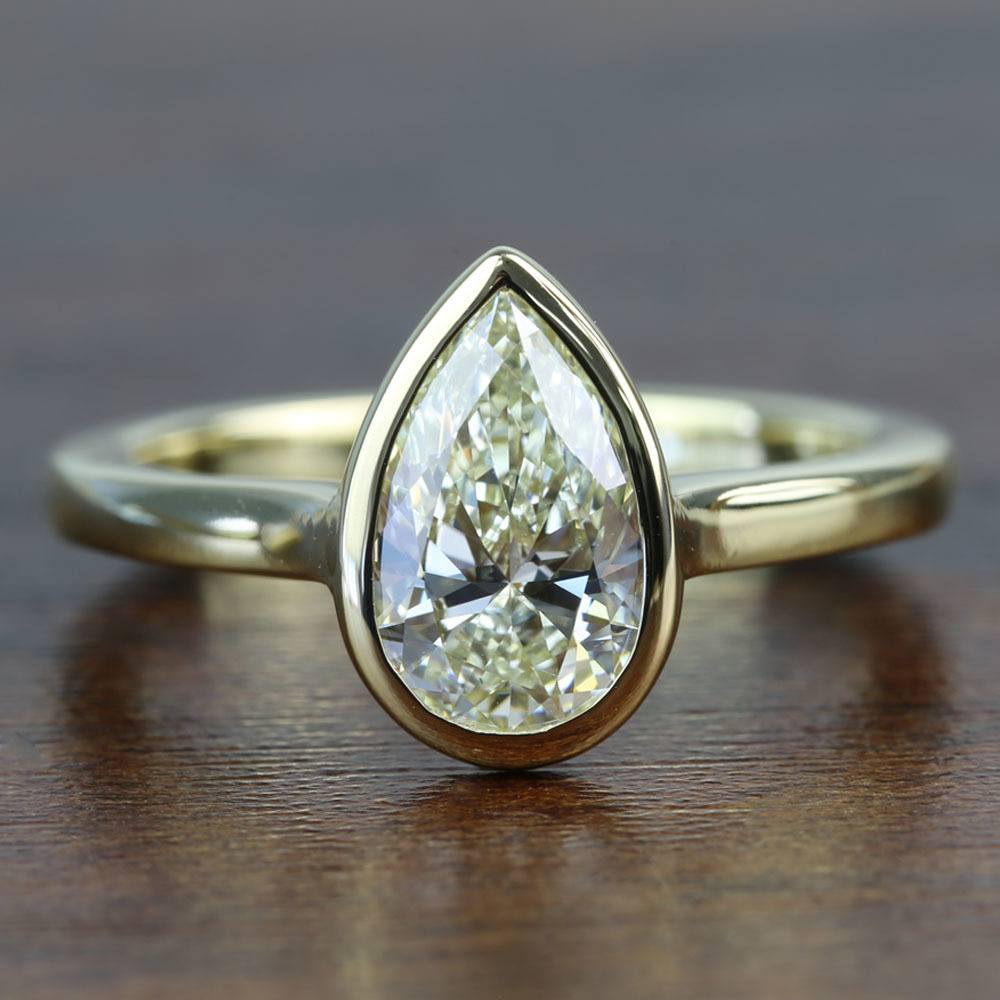 bezel pear diamond ring