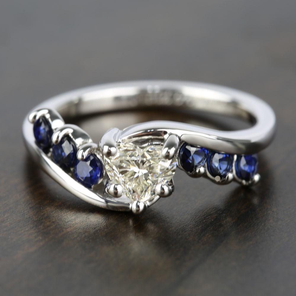 Swirl Style Heart Shaped Diamond And Sapphire Ring